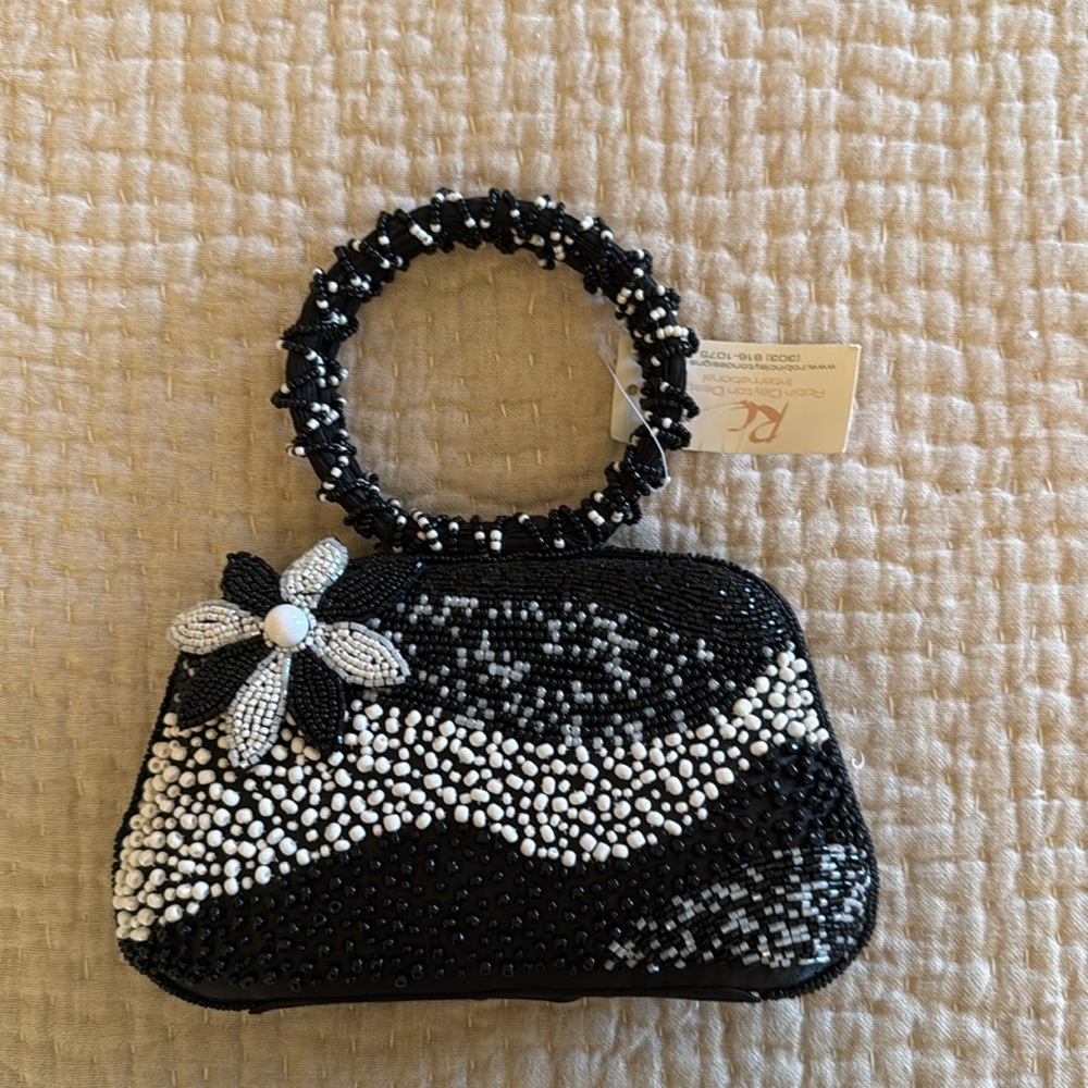Women’s beaded fashion purse - black & white beading with flower accessory